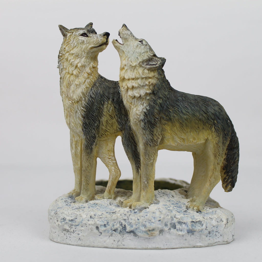 Statue of two wolves on a white background