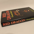 Book titled 'Red Dragon' by Thomas Harris on a beige background