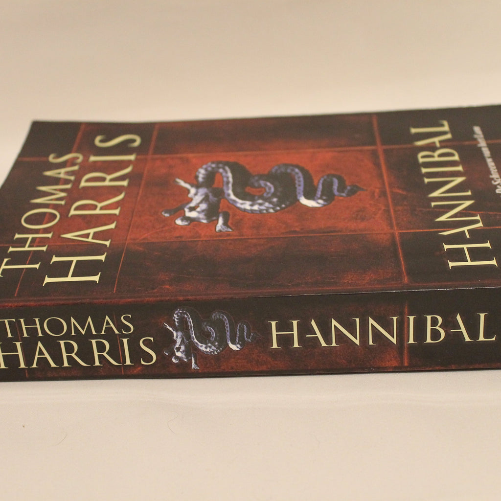 Book titled 'Hannibal' by Thomas Harris on a beige background