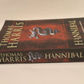 Book titled 'Hannibal' by Thomas Harris on a beige background