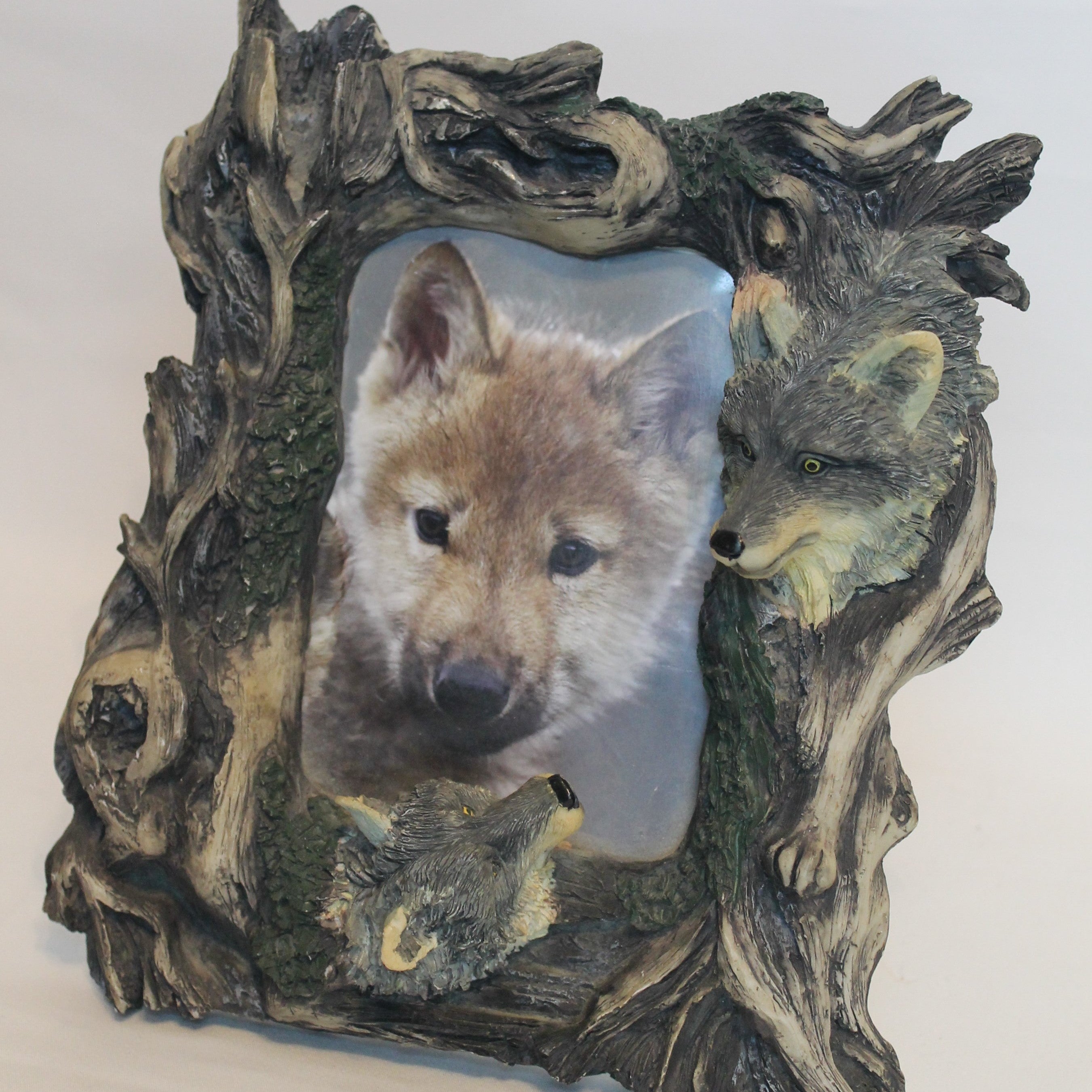 Decorative frame with wolf design on a white background