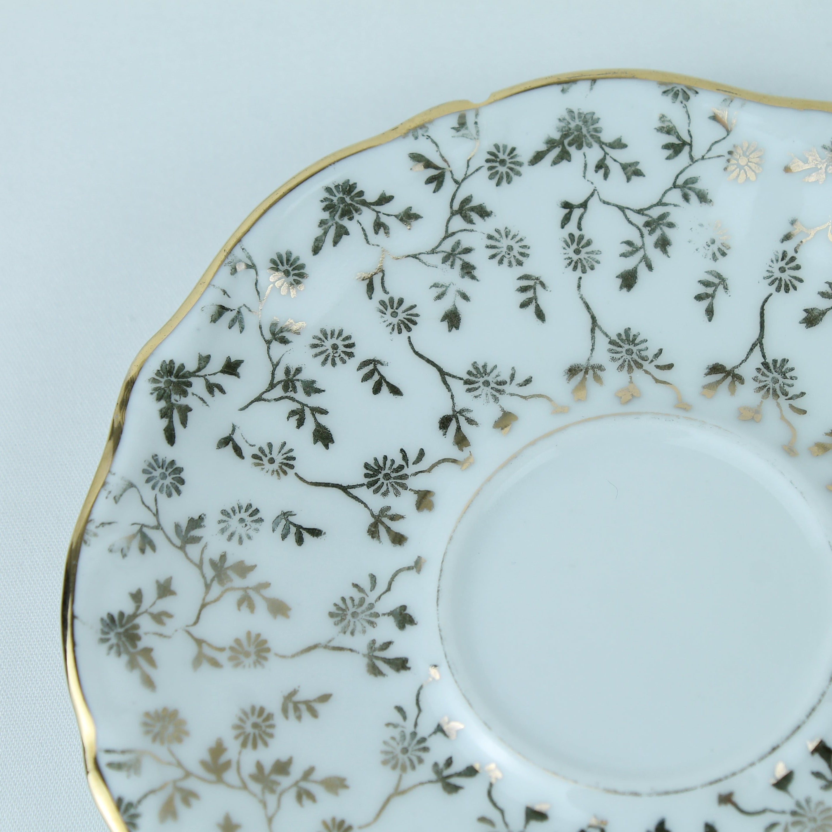 Decorative ceramic plate with floral patterns on a light blue background
