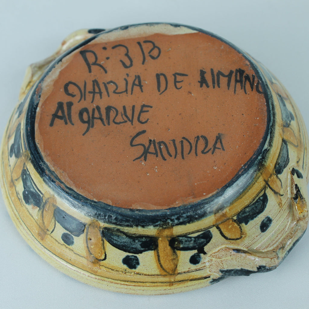 Ceramic dish with text on a white background