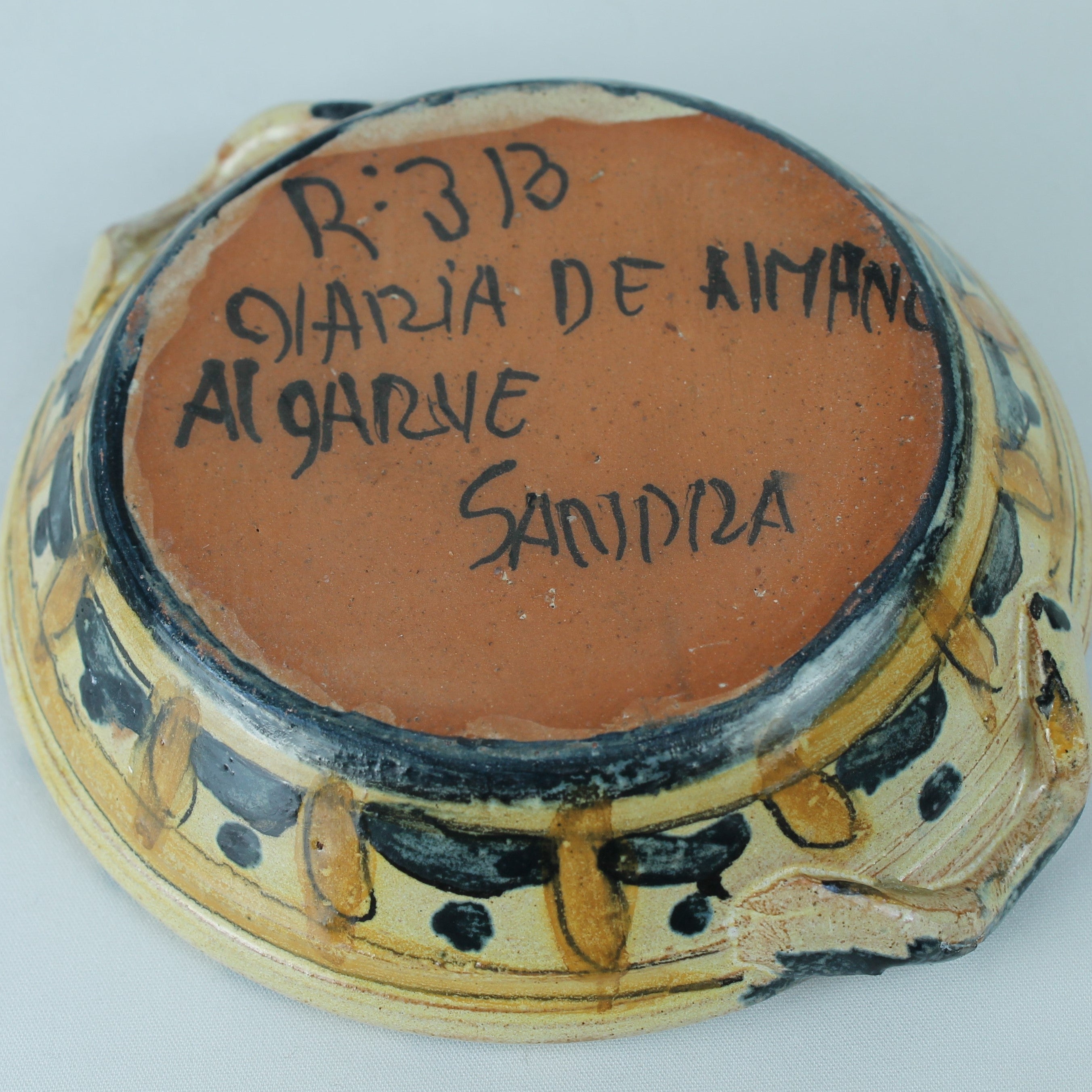 Ceramic dish with text on a white background