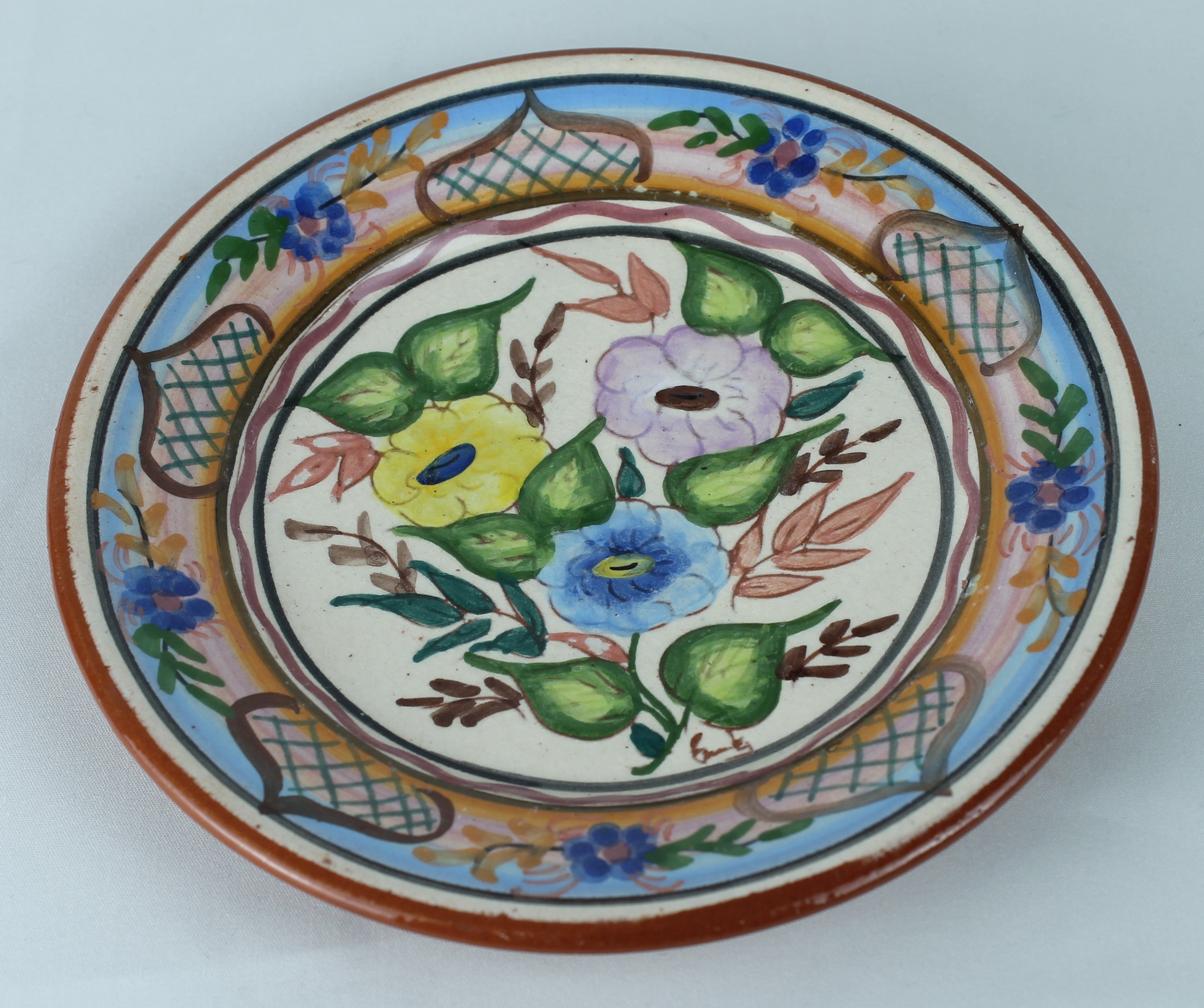 Hand-painted Spanish Pottery Plate (16 cm) – Polychrome Floral Motif & Terracotta Rim