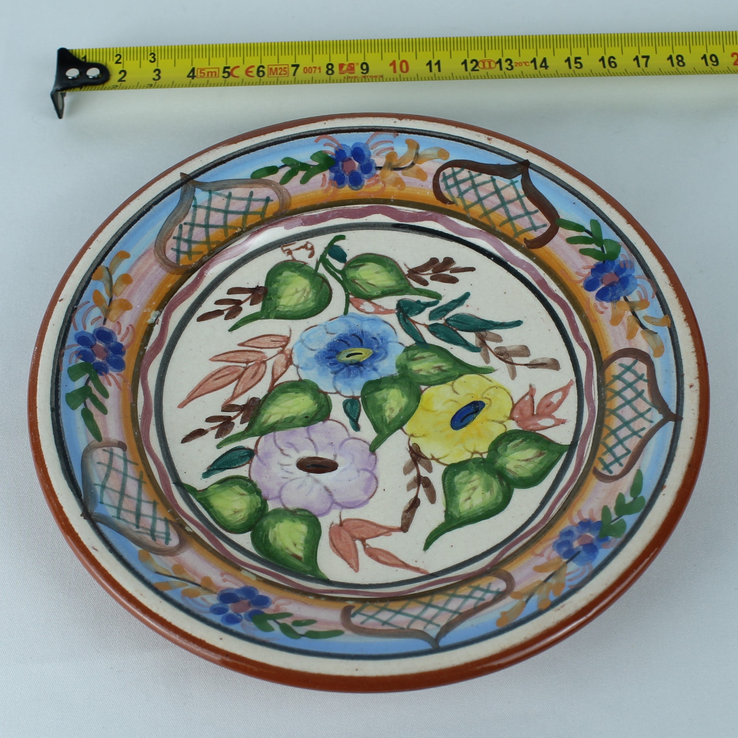 Hand-painted Spanish Pottery Plate (16 cm) – Polychrome Floral Motif & Terracotta Rim