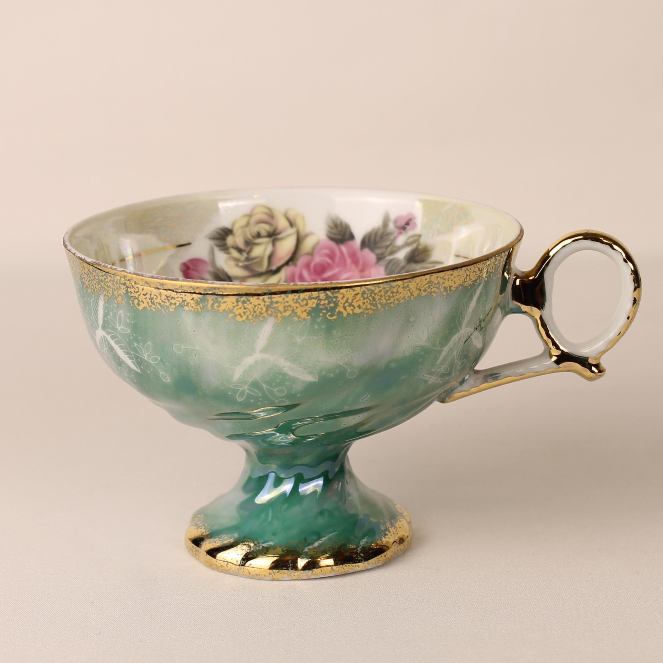 Voetkopje met lustre glazuur - groen gemarmerd porselein met rozen en goudrand