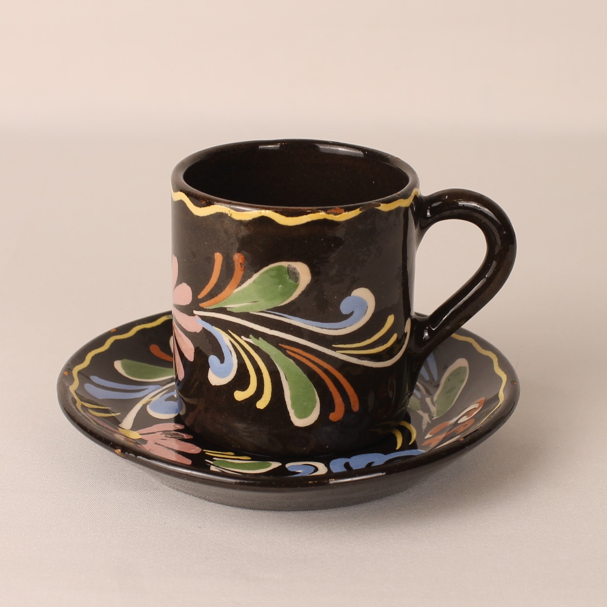 Vintage hand-painted espresso cup and saucer – brown ceramic with colorful floral motif