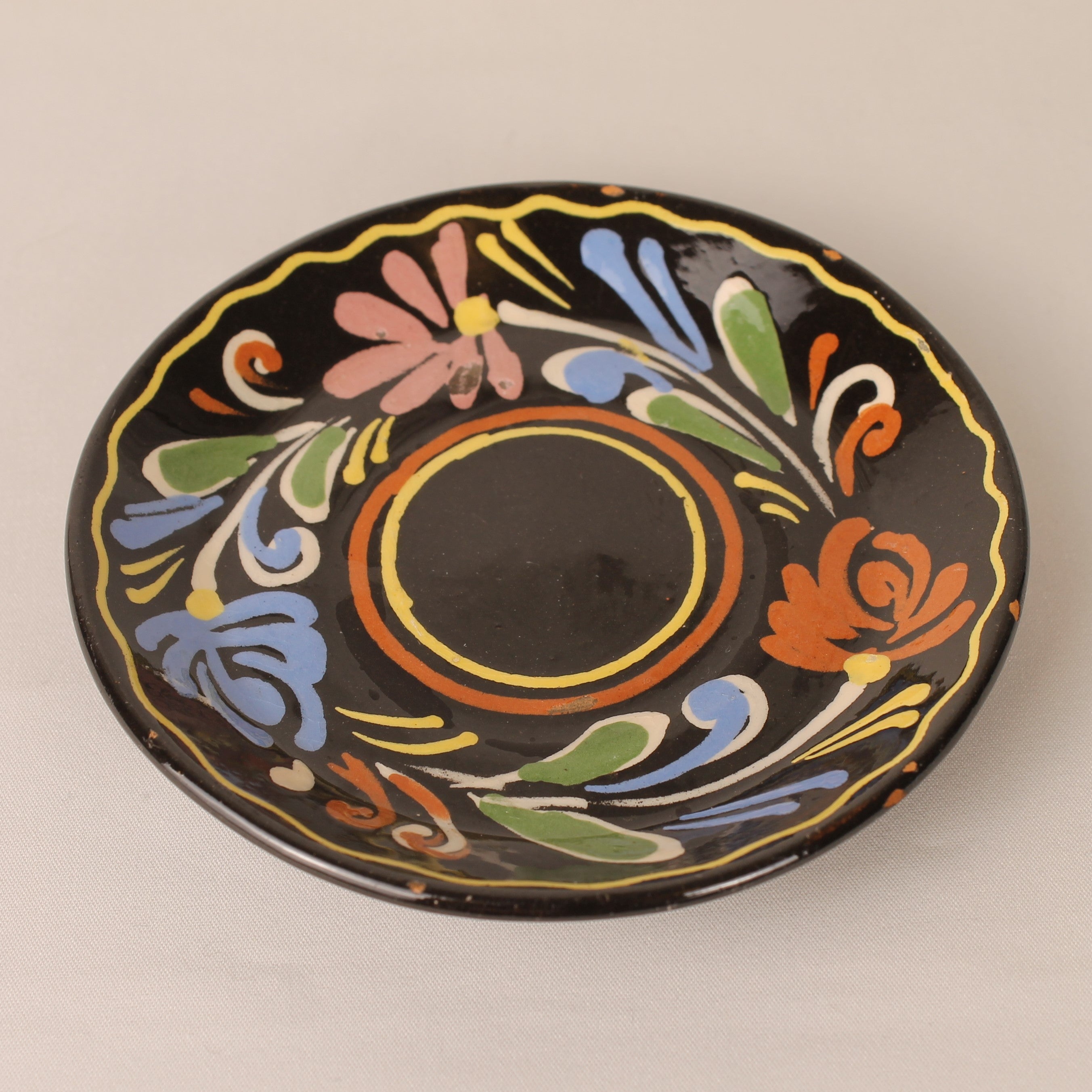 Vintage hand-painted espresso cup and saucer – brown ceramic with colorful floral motif