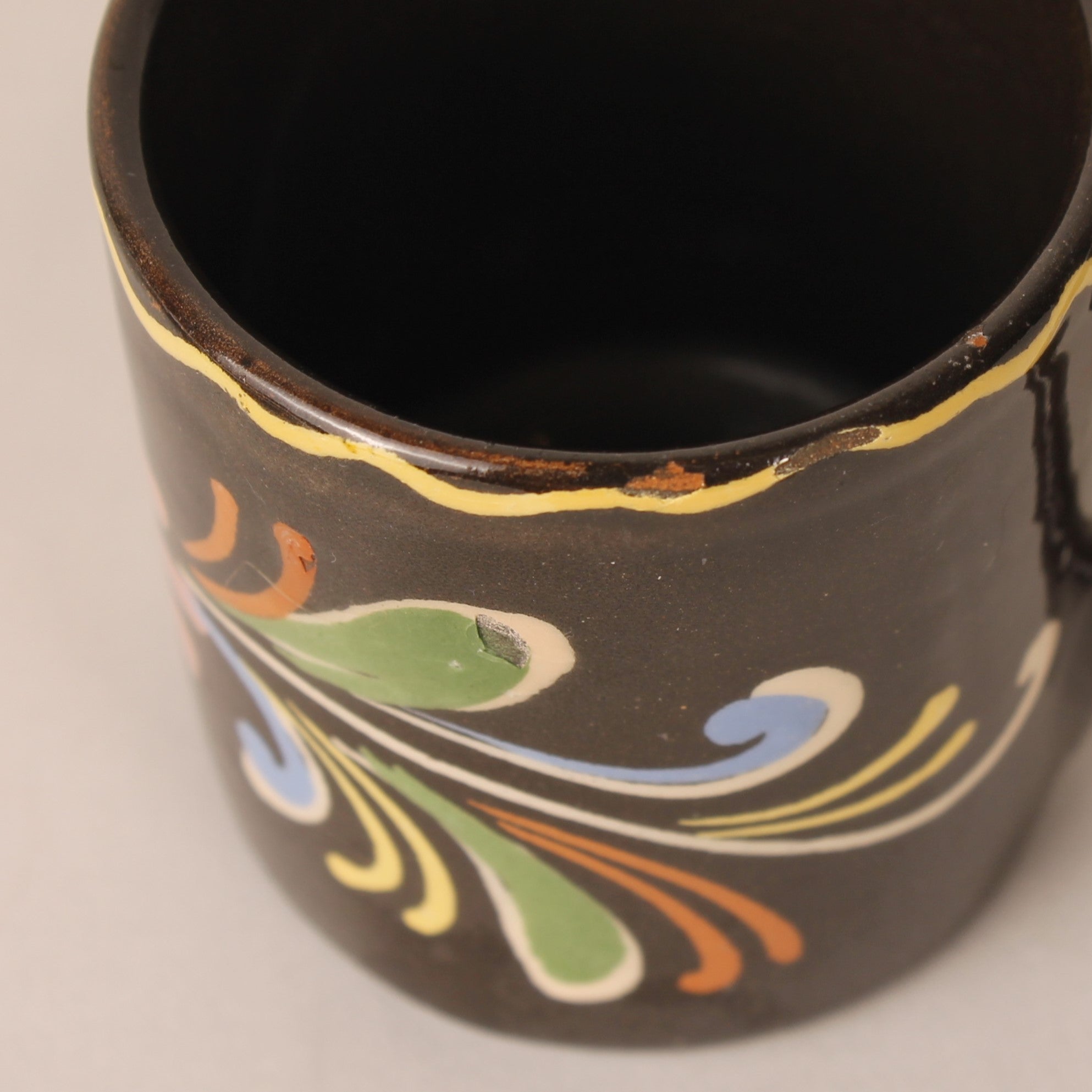 Vintage hand-painted espresso cup and saucer – brown ceramic with colorful floral motif