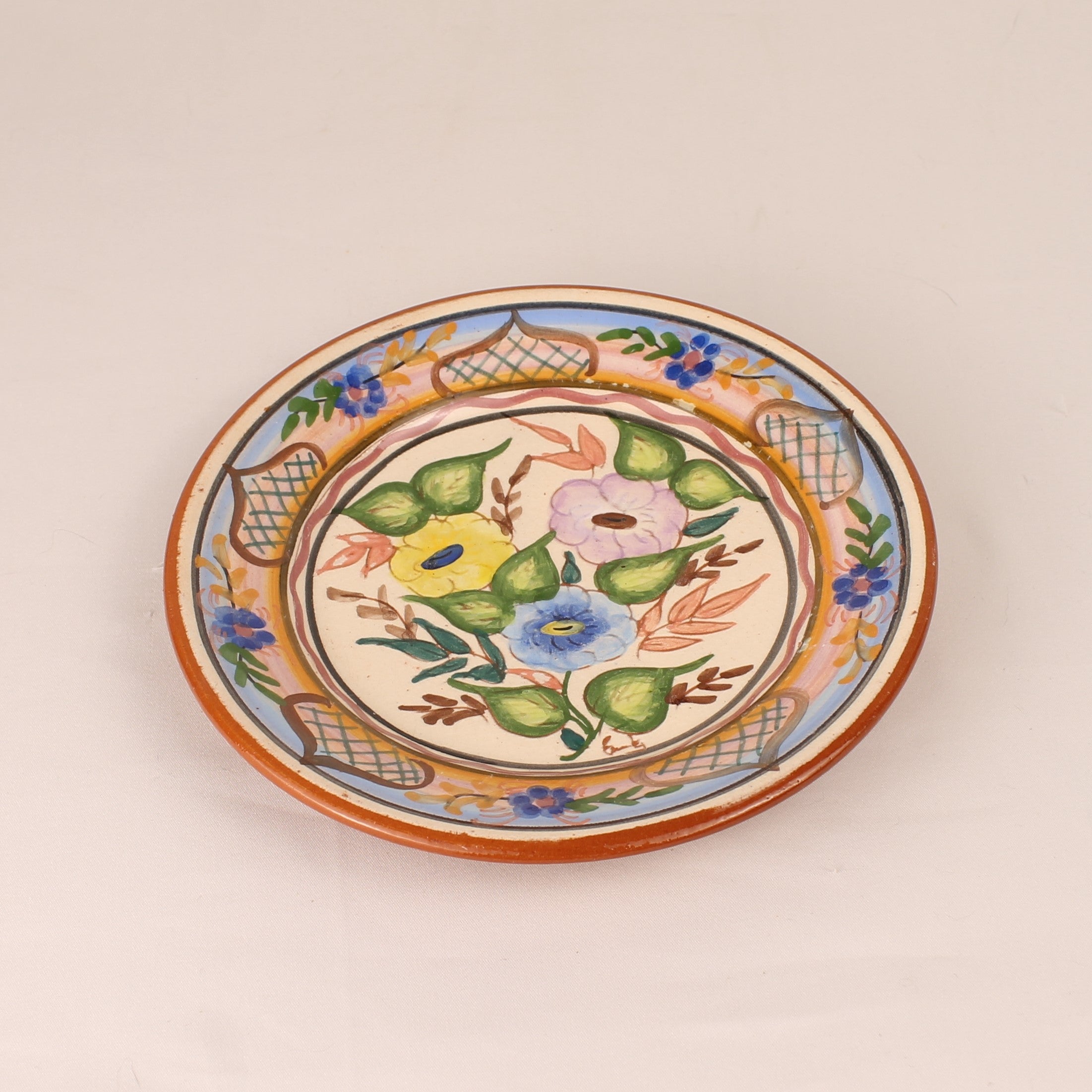 Hand-painted Spanish Pottery Plate (16 cm) – Polychrome Floral Motif & Terracotta Rim