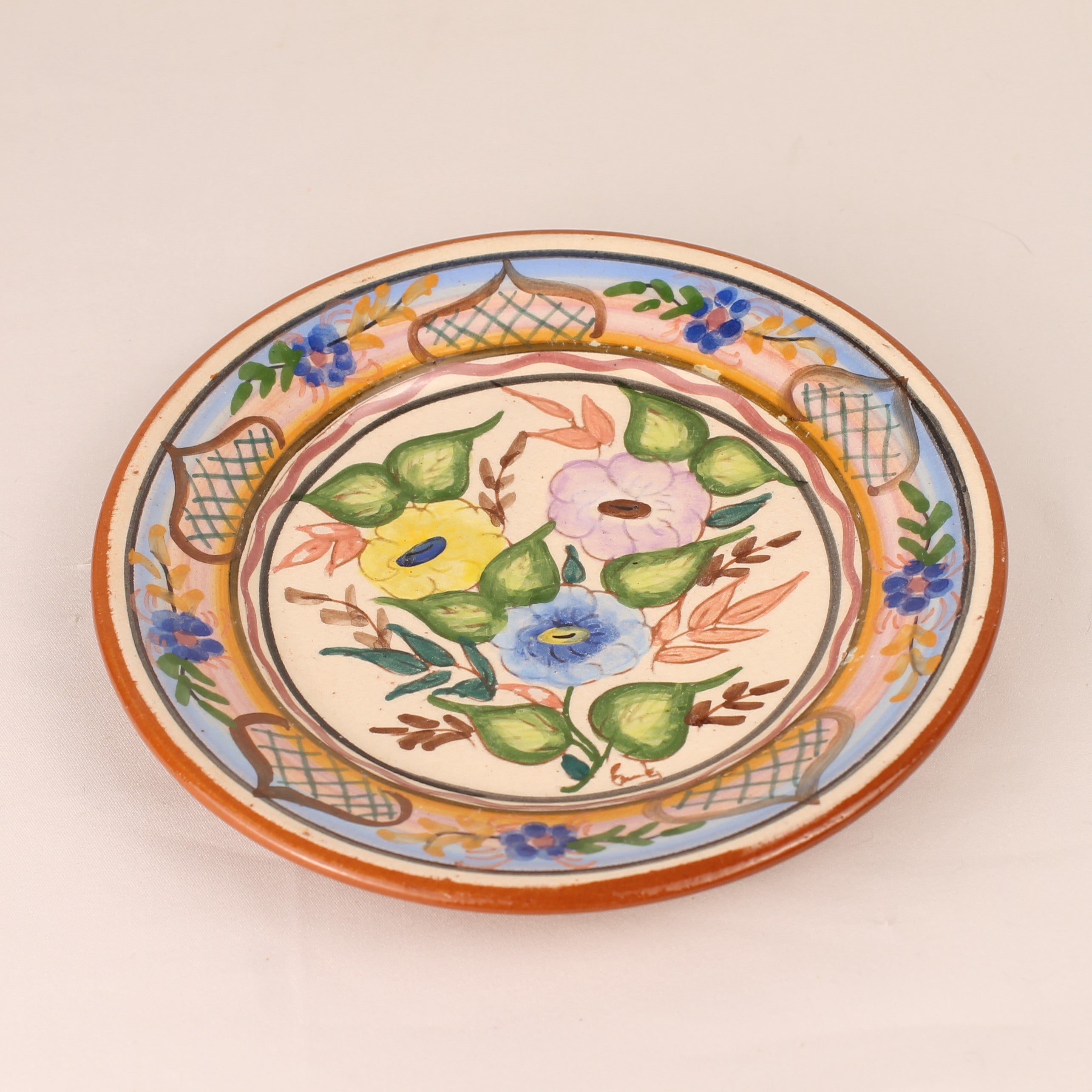 Hand-painted Spanish Pottery Plate (16 cm) – Polychrome Floral Motif & Terracotta Rim