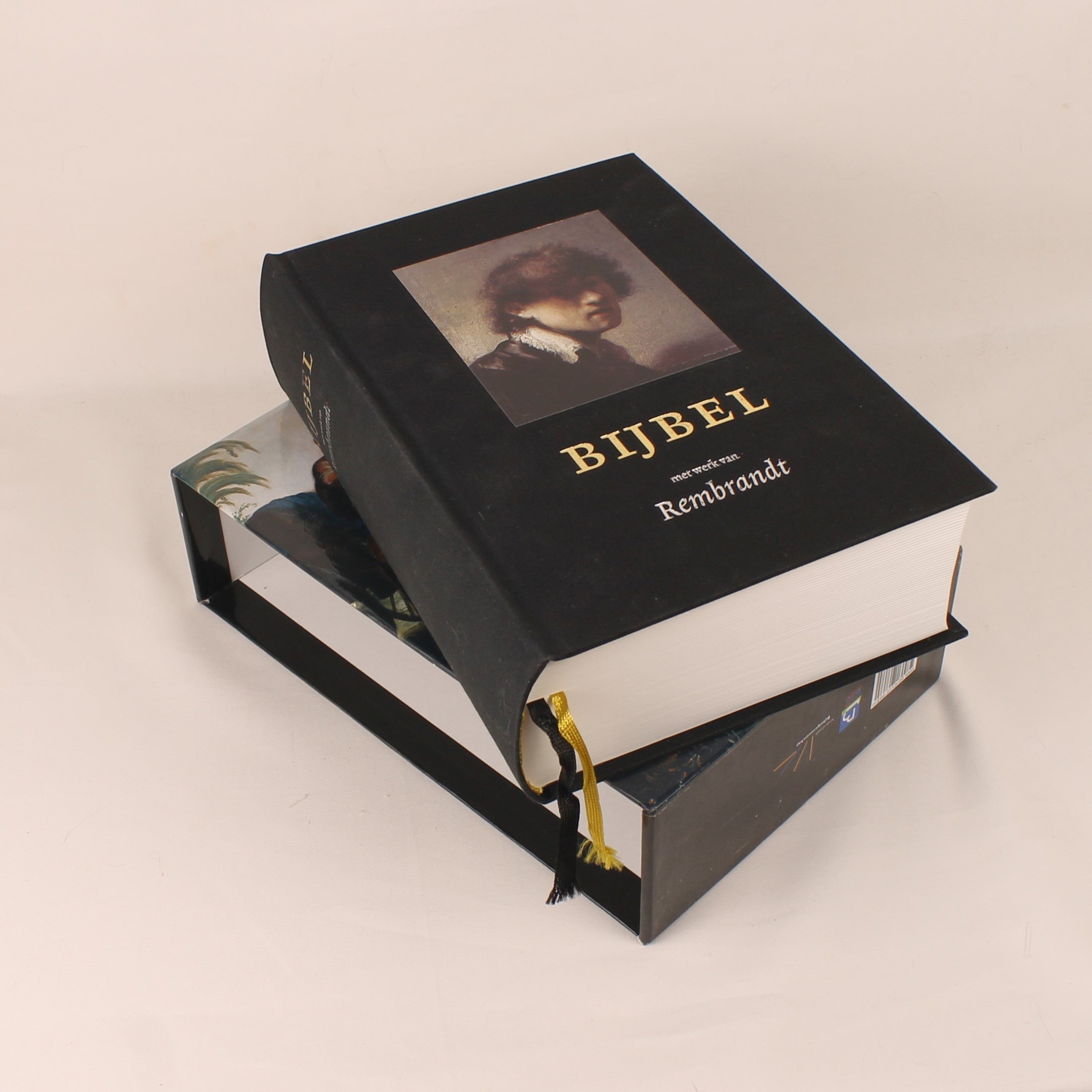 Decorative Bible with Rembrandt portrait on a beige background