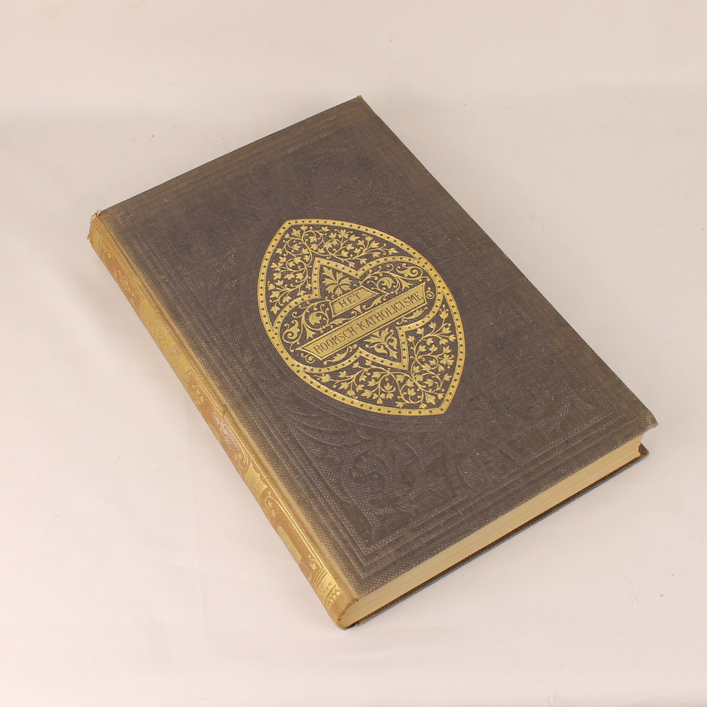 Vintage book with decorative emblem on a beige background