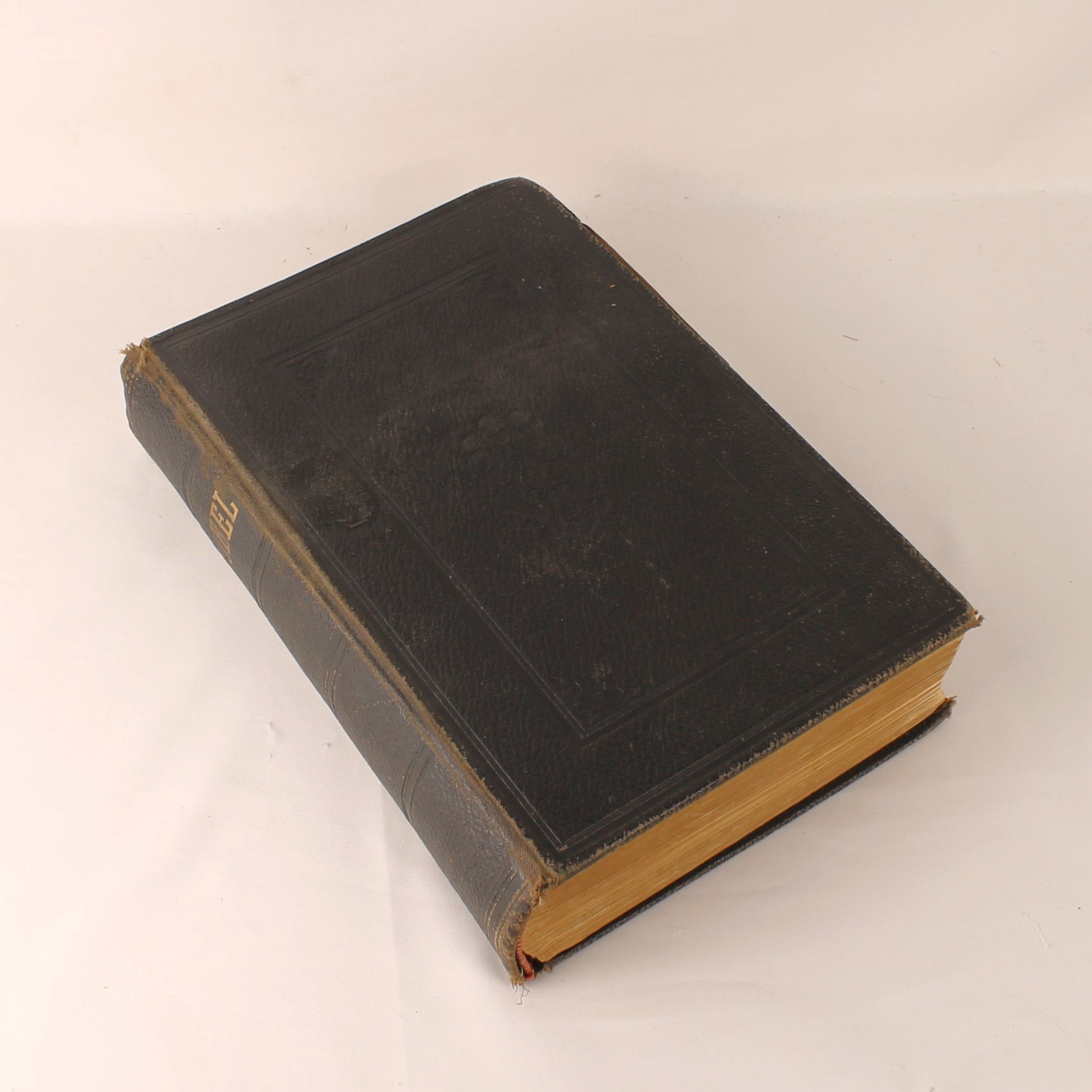 Vintage leather-bound book on a white background