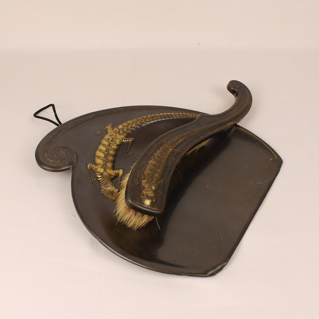 Traditional shoe shining brush with black leather holder on a white background