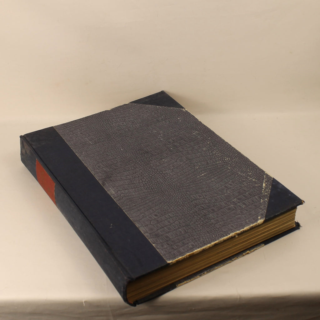 Vintage book with dark leather binding on a light background
