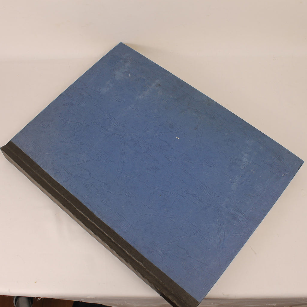 Blue book on a white surface