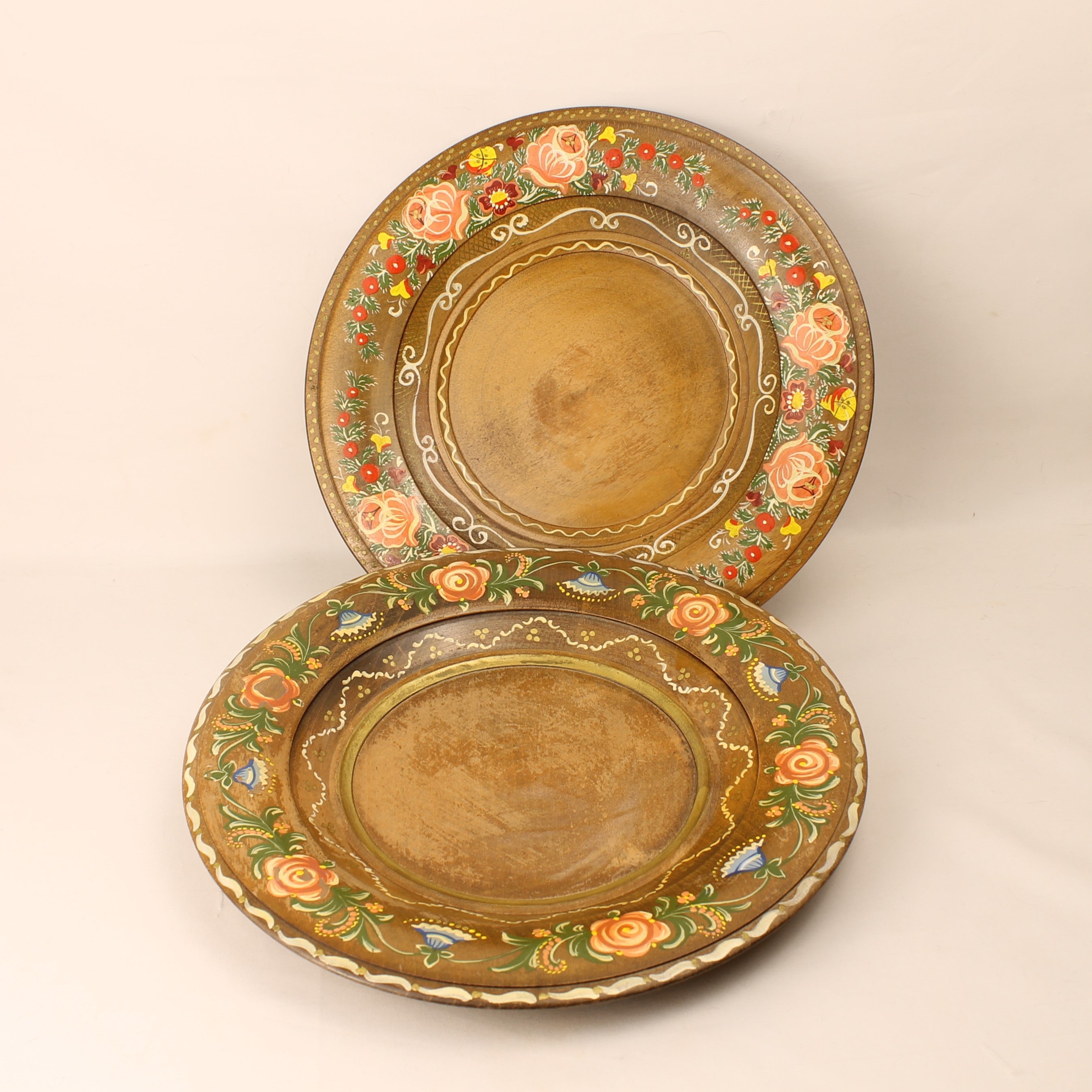 Decorative wooden box with floral patterns on a beige background