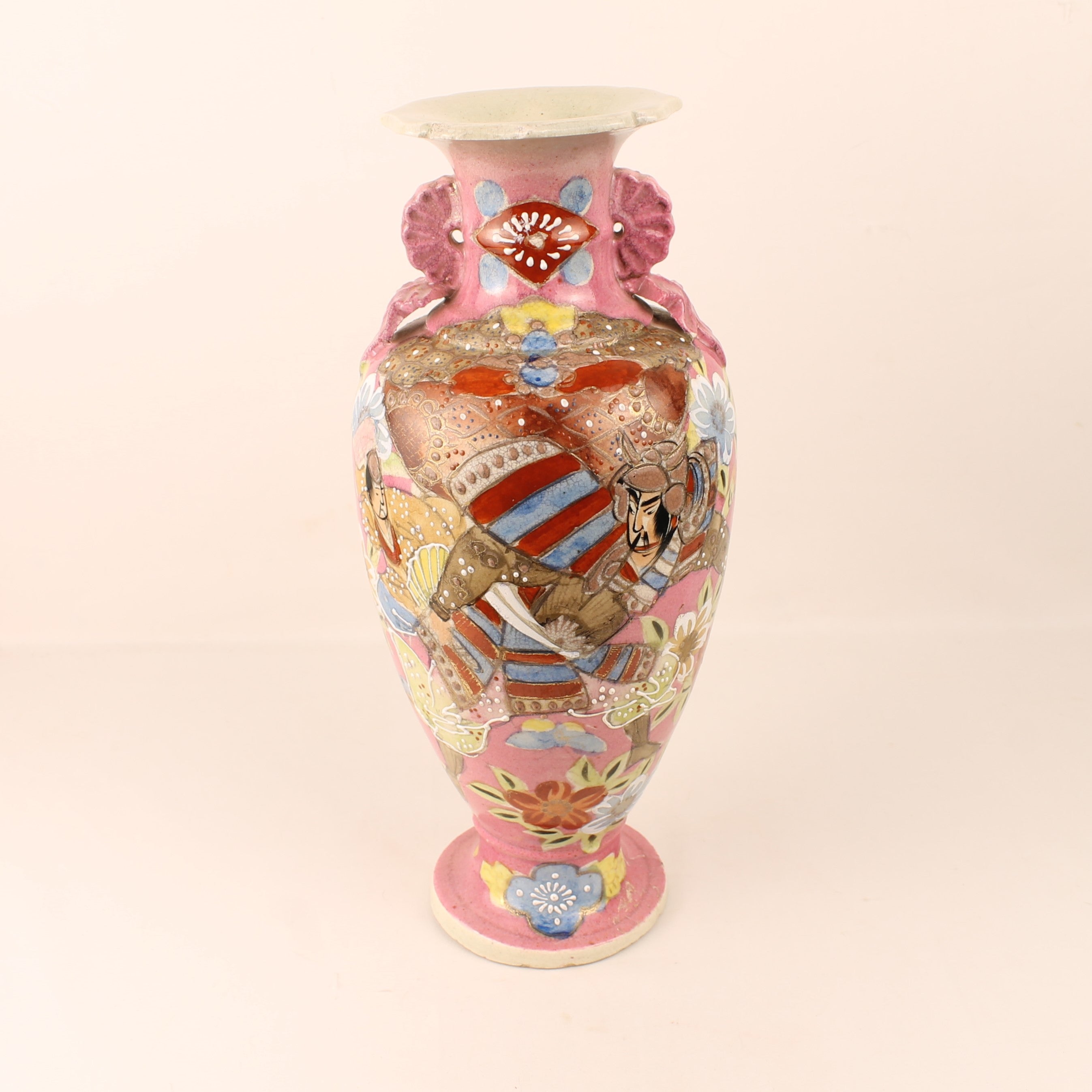 Decorative vase with animal illustrations on a beige background
