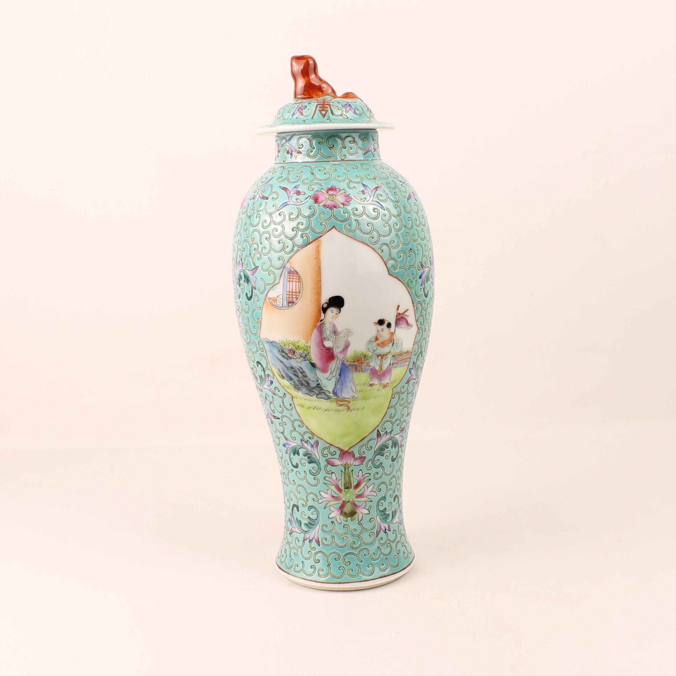 Decorative vase with colorful artwork on a light beige background