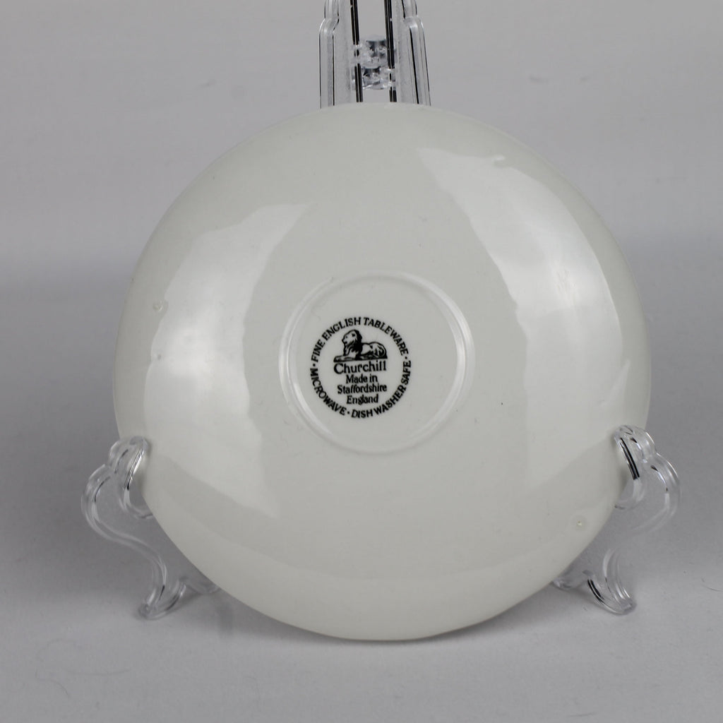 White ceramic bowl with a visible brand logo on a gray background