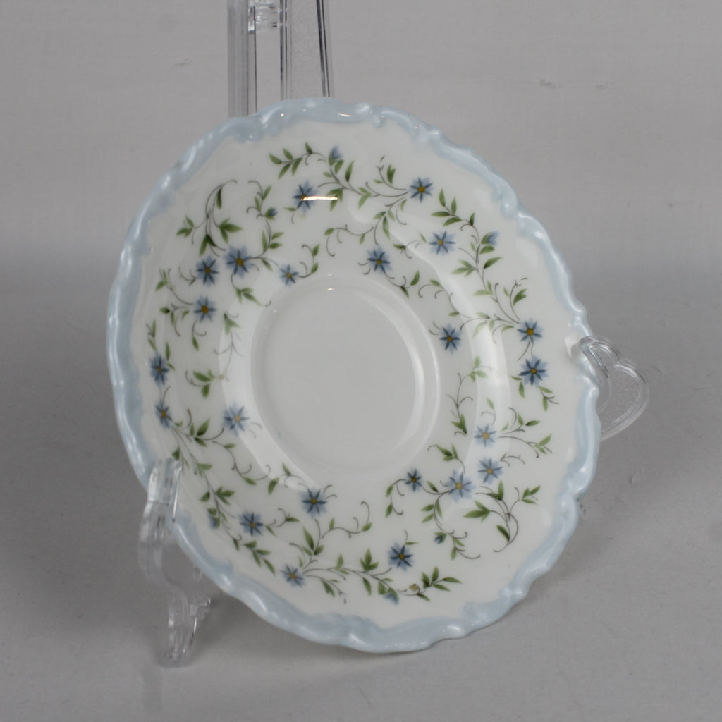 Decorative plate with floral pattern on a gray background