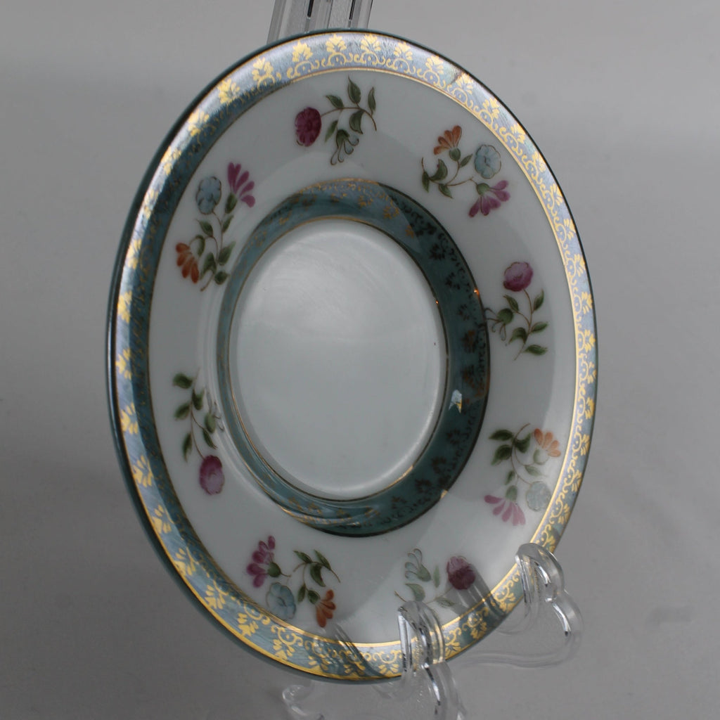 Decorative ceramic plate with floral patterns on a gray background