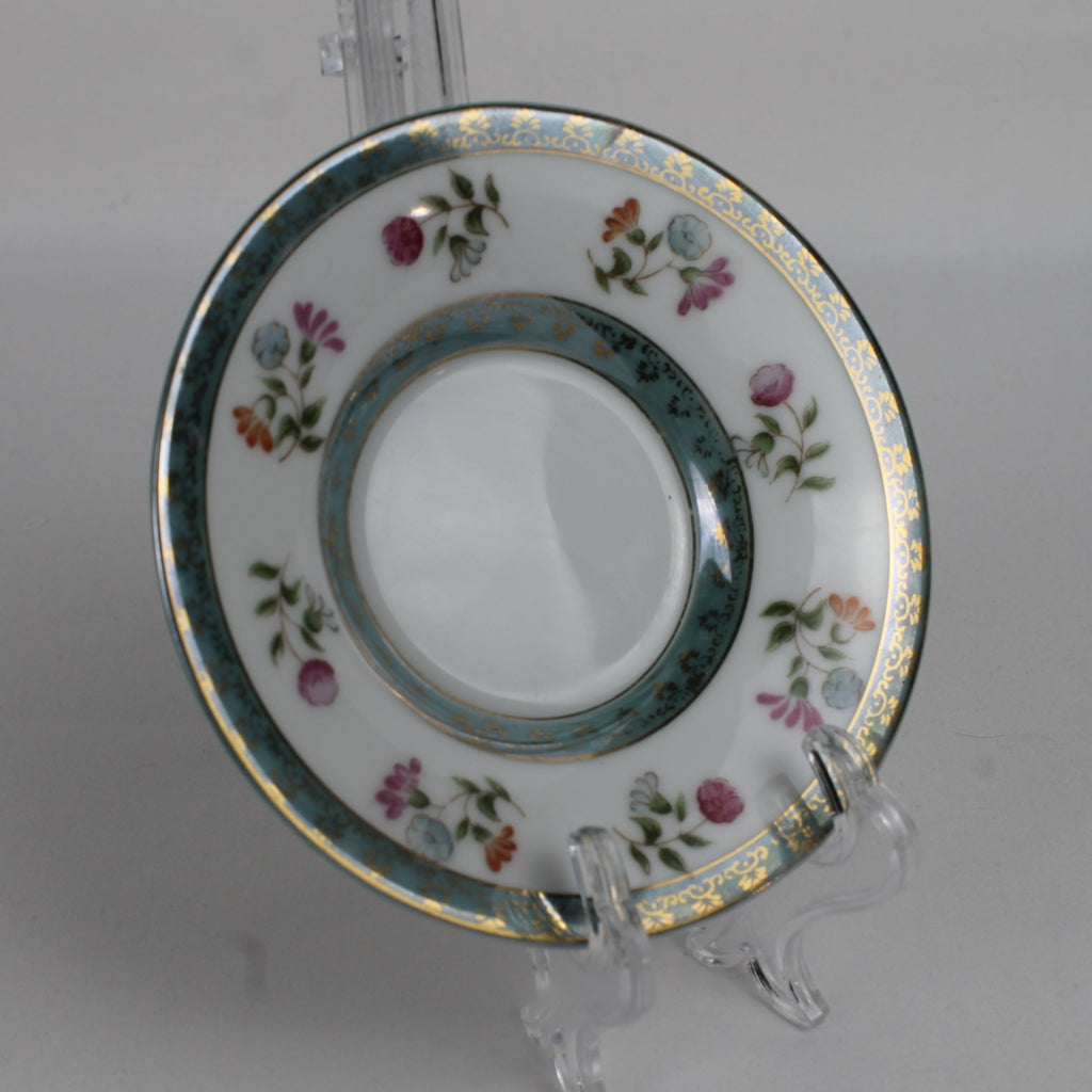 Decorative ceramic plate with floral patterns on a white background
