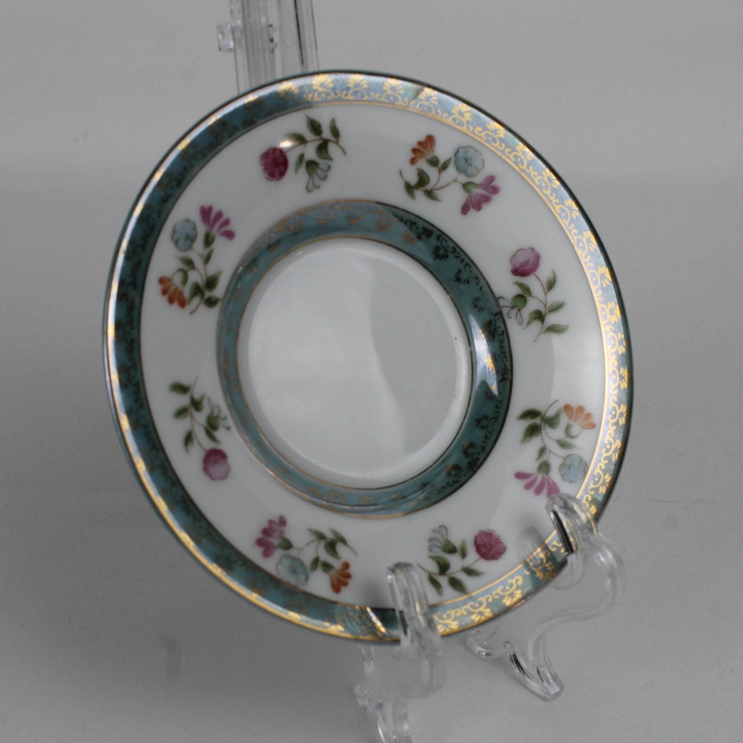 Decorative ceramic plate with floral patterns on a white background