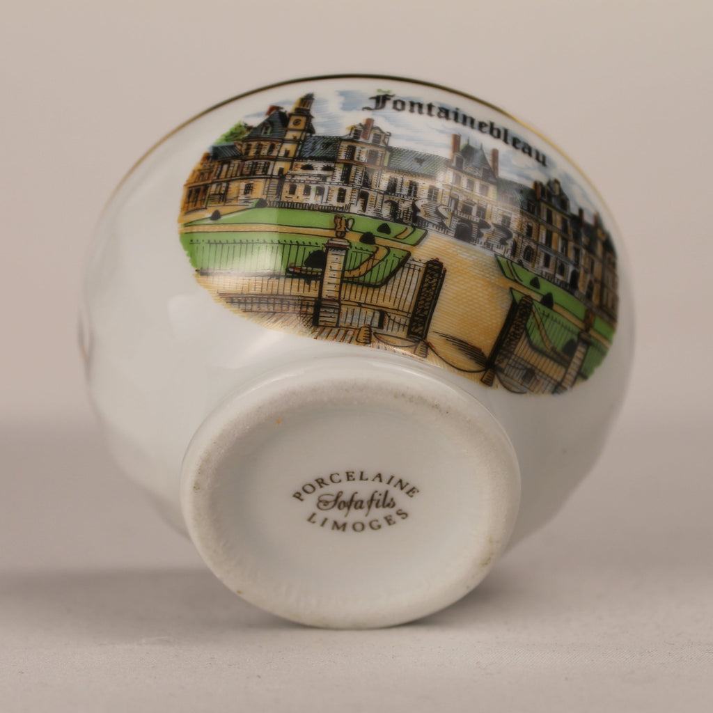 Ceramic vase with decorative top and 'L'Enluminée' branding on a beige background