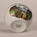 Ceramic vase with decorative top and 'L'Enluminée' branding on a beige background